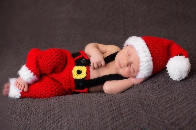 Baby sleeping on purple blanket