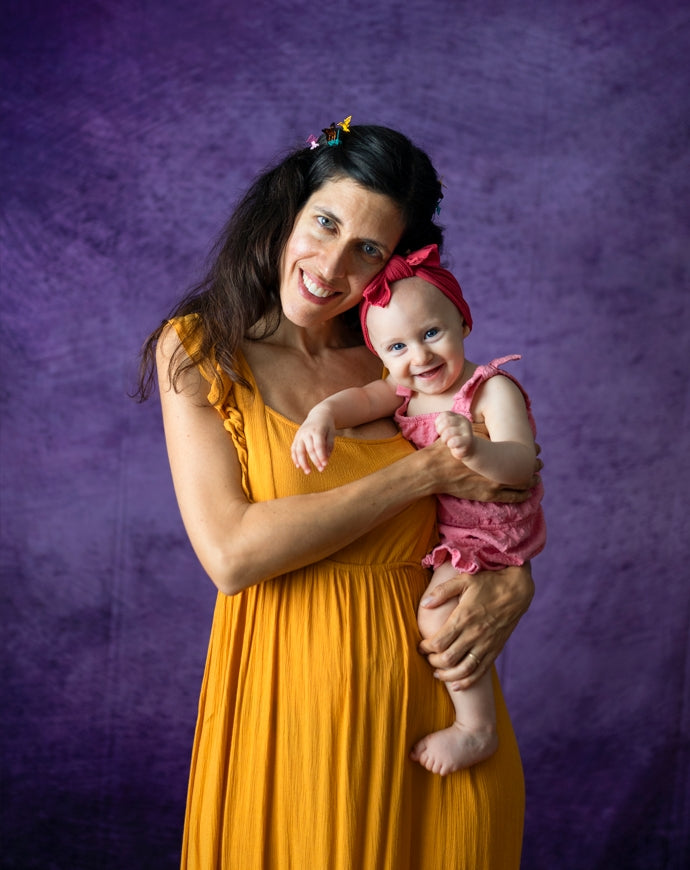 Mommy and me in front of purple abstract backdrop