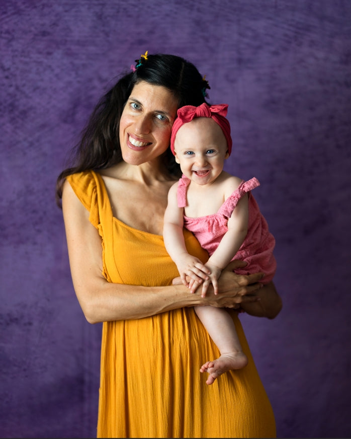 Mommy and me in front of purple abstract backdrop