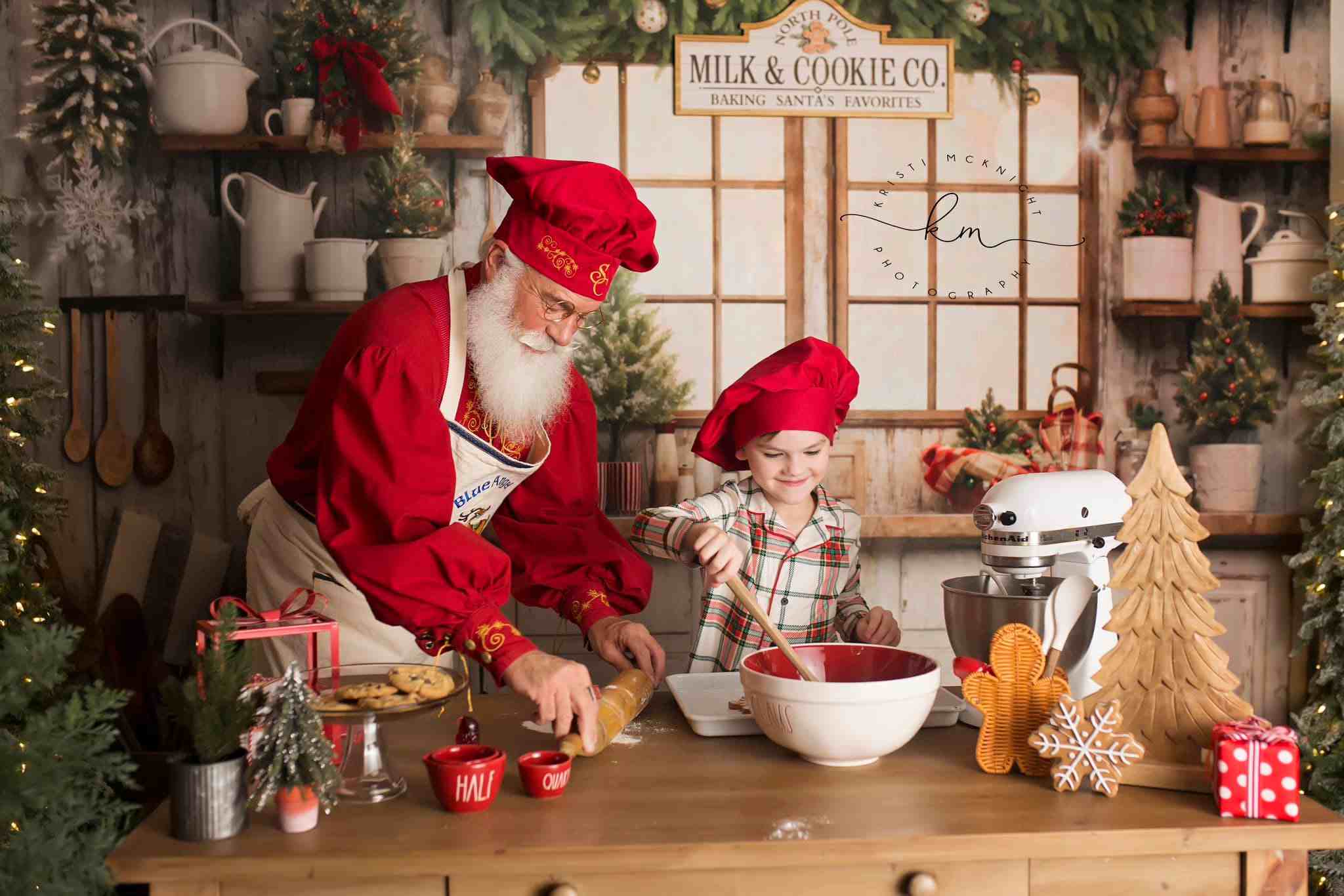 Grandpa and grandson making gingerbread in front of Christmas Kitchen Backdrop