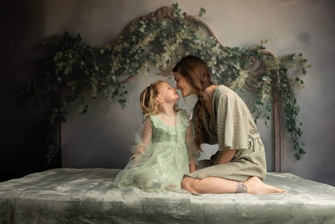 Mom and me in front of the Greenery Headboard Backdrop