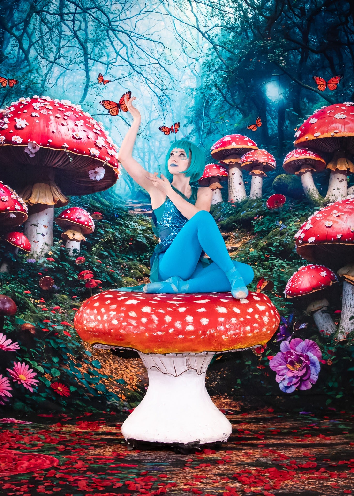 Girl sitting on mushroom in front of forest fairy tale backdrop