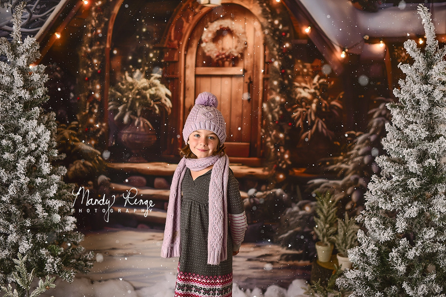 Girl in hat standing in front of Kate Christmas Wooden House Backdrop