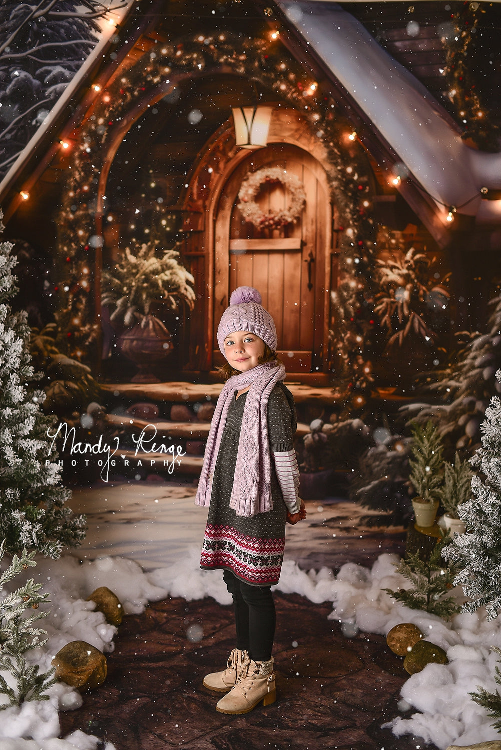 Girl in hat standing in front of Kate Christmas Wooden House Backdrop