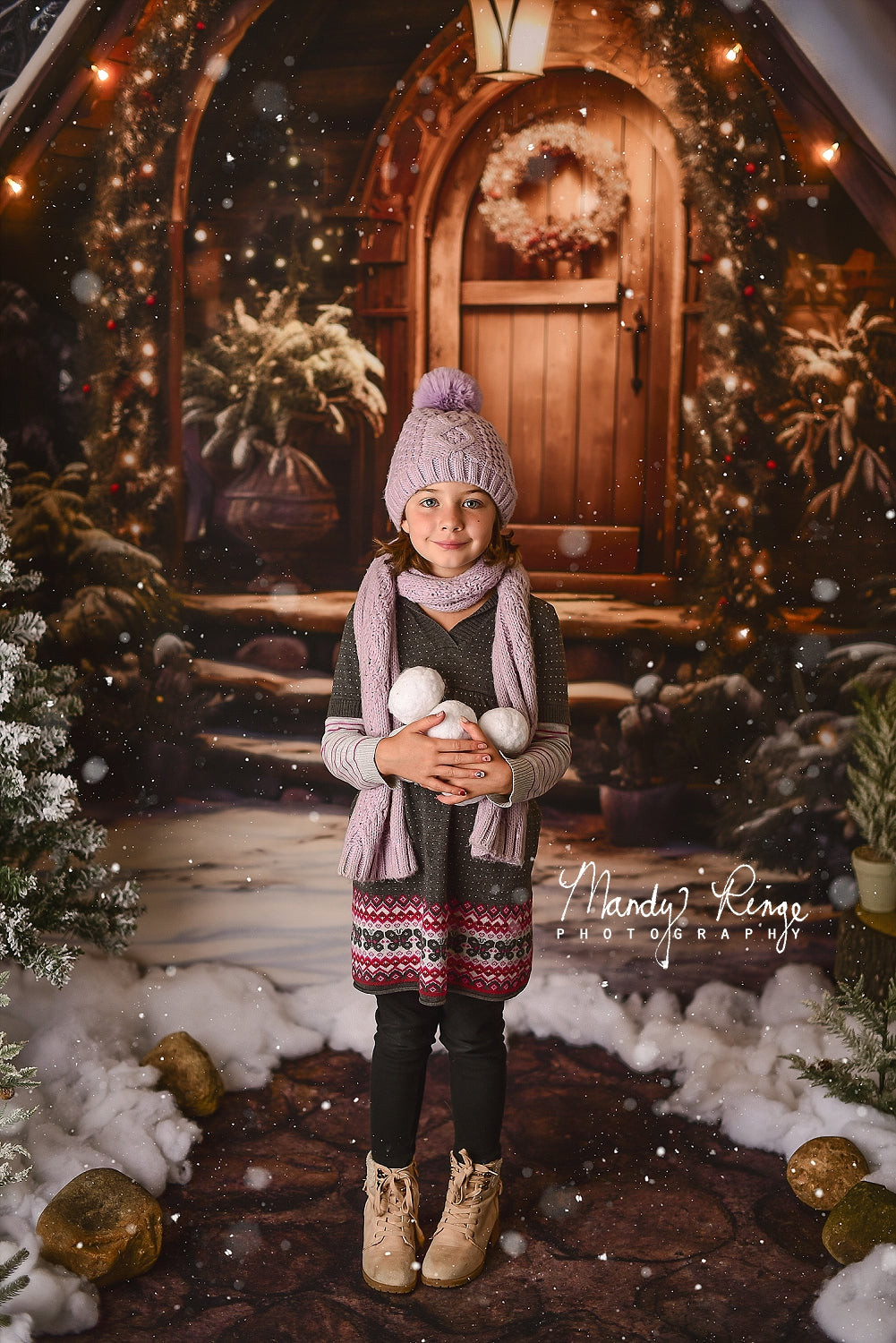 Girl in hat standing in front of Kate Christmas Wooden House Backdrop